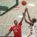 Canton's Jordan Nobles blocks Ypsilanti's Jocob Simmons' shot during first half of the regional semifinal game at Huron High School March 11.
Courtney Sacco I AnnArbor.com  