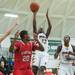 Ypsilanti's Jocob Simmons jumps to make a shot during first half of the regional semifinal game against Canton at Huron High School March 11.
Courtney Sacco I AnnArbor.com  