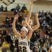 Dexter's Crystal Kedroske jumps as she tires to make a basket against Heritage during first half of the state quarterfinals game at Davison High School Tuesday, Mar. 13th.
Courtney Sacco I AnnArbor.com  