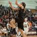 Dexter's Kathryn Pisano jumps as she tires to make a layup against Heritage during first half of the state quarterfinals game at Davison High School Tuesday, Mar. 13th.
Courtney Sacco I AnnArbor.com  