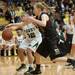 Dexter's Riley McDonald and Heritage's Aubree Snow go after a loose ball during first half of the state quarterfinals game at Davison High School Tuesday, Mar. 13th.
Courtney Sacco I AnnArbor.com  