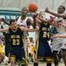 Ypsilanti and South Lyon plays lung as they try to make a rebound  during the second quarter of the Class A regional finales at Huron High School Wednesday, Mar.13th.Courtney Sacco I AnnArbor.com 