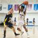 Ypsilanti's Justin Bernard drives the ball up court as he is guarded by South Lyon's Bill Harrison during the first half of the Class A regional finales at Huron High School Wednesday, Mar.13th.Courtney Sacco I AnnArbor.com 