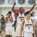 Ypsilanti's Jaylen Johnson raises his arms in the air as he celebrates    winning the Class A regional finales at Huron High School Wednesday, Mar.13th.Courtney Sacco I AnnArbor.com 