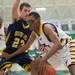Ypsilanti's Jalen Harmon drives the ball to the basket as South Lyon's Bill Harrison during the first half of the Class A regional finales at Huron High School Wednesday, Mar.13th.Courtney Sacco I AnnArbor.com 