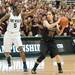 Dexter's Teia McGahey looks for an open team mate as Grosse Pointe South's Cierra Rice guards her during the second quarter of Class A girls state semi-finals healed at the Breslin Center in East Lansing Friday Mar. 15th.
Courtney Sacco I AnnArbor.com 