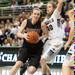 Dexter's Emma Kill drives the ball to the basket as Grosse Pointe South's Gretchen Shirar guards her during the third quarter of Class A girls state semi-finals healed at the Breslin Center in East Lansing Friday Mar. 15th.
Courtney Sacco I AnnArbor.com  