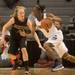 Grosse Pointe South's Cierra Rice drives the ball past Dexter's Riley McDonald during the Class A girls state semi-finals healed at the Breslin Center in East Lansing Friday Mar. 15th.
Courtney Sacco I AnnArbor.com  