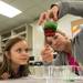 WCC student Sara Zimmerman demonstrates to 8-year-old Lexis Onyakin how liquids can have different densities during a trip to Washtenaw Community College a group of forth graders from Willow Run Community Schools took on March 20. Courtney Sacco I AnnArbor.com   