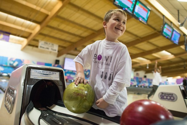 Five-year-old Adam DeGregorio picks up his bowling ball as he plays a frame during the Bowl for Kids' Sake fundraiser at Colonial Lanes in Ann Arbor Saturday, March 23. Courtney Sacco I AnnArbor.com 