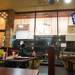Three people enjoy a slice of pizza at New York Pizza Depot on East William Street in downtown Ann Arbor as they watch the Wolverines play Syracuse in the Final Four Saturday night. Courtney Sacco I AnnArbor.com