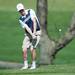 Saline's Caleb Wittig makes a chip shot on the 15th hole during the golf match at the University of Michigan golf course Wednesday May, 1.
Courtney Sacco I AnnArbor.com  