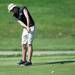 Pioneer's Nate Yankel putts the ball on the 15th hole during the golf match at the University of Michigan golf course Wednesday May, 1.
Courtney Sacco I AnnArbor.com   