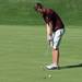 Dexter's Tyler King putts the ball on the 15th hole during the golf match at the University of Michigan golf course Wednesday May, 1.
Courtney Sacco I AnnArbor.com   