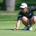 Pioneer's Ted Xiao reads the green on the 10th hole during the golf match at the University of Michigan golf course Wednesday May, 1.
Courtney Sacco I AnnArbor.com   