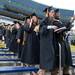 Two graduates poses for a photo as they make their way through the Big House during the University of Michigan's spring commencement, Saturday May 4.
Courtney Sacco I AnnArbor.com    