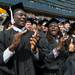 University of Michigan quarterback Devin Gardner and former quarterback Denard Robinson cheer at the end of the 2013 Commencement ceremony.
Courtney Sacco I AnnArbor.com