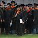 A graduate looks out at the Big House as she makes her way through the stadium during the University of Michigan's spring commencement, Saturday May 4.
Courtney Sacco I AnnArbor.com    