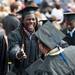 Former Wolverines quarterback Denard Robinson shakes hands with a few graduating students as they take their seats in the Big House before the start of the University of Michigan's spring commencement, Saturday May 4.
Courtney Sacco I AnnArbor.com    