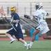 Saline's Brett Braun funs the ball up the field with and Huron's Jared Tooles right behind him during their game Wednesday, May 8.
Courtney Sacco I AnnArbor.com  