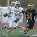 Huron's Nils Urbaniak runs the ball around the net during their game against Saline Wednesday, May 8.
Courtney Sacco I AnnArbor.com  