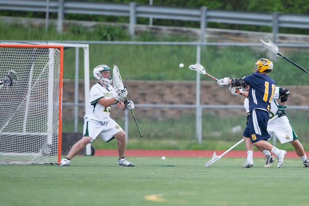 Saline's Brett Braun shoots the ball at Huron's net during their game a Huron high school Wednesday, May 8.
Courtney Sacco I AnnArbor.com  
