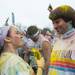 Runners covered in colored power celebrate, with music, dancing in Riverside Park after completing The Color Run in Ypsilanti, Saturday May 11.
Courtney Sacco I AnnArbor.com 