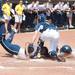 Wolverines freshmen Sierra Lawrence slides home but is tagged out by California's Lindsey Ziegenhirt during the second inning of their game, Saturday May 18.
Courtney Sacco I AnnArbor.com 