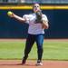 The Wolverines senior Ashley Lane throws the ball to first for an out during the first inning of their game against California, Saturday May 18.
Courtney Sacco I AnnArbor.com     