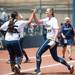 Wolverines pitcher Sara Druesebga and catcher Lauren Sweet high fiver to celebrate their five to zero win over California, Saturday May 18.
Courtney Sacco I AnnArbor.com     