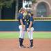 Wolverines pitcher Sara Driesenga and first basemen Caitlin Blanchard talk before the start of the bottom of the seventh.
Courtney Sacco I AnnArbor.com