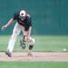 Big Reds Thomas Lindeman misses the ball as he tries to catch it during the fifth inning of their regional tournament game against Riverview, Saturday June 8.
Courtney Sacco I AnnArbor.com 