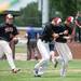 Milan's Big Reds celebrate after defeating Riverview 4-1 in the first round of the regional tournament at Airport High School, Saturday, June 8.
Courtney Sacco I AnnArbor.com   