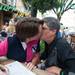 Tracy Mac kisses her partner of 12 years Dana Bauer as they fill out a petition for marriage equality at a rally held in Ann Arbor's Kerrytown, Wednesday, June 26. Courtney Sacco I AnnArbor.com    