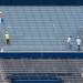 Crews work to paint the Michigan stadium bowl Wednesday, June, 26. 
Courtney Sacco I AnnArbor.com