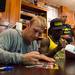 Jordan Kovacs, safety for the Miami Dolphins and former Michigan football player, signs an autograph at the M Den on Wednesday, July, 10. 
Courtney Sacco I AnnArbor.com    