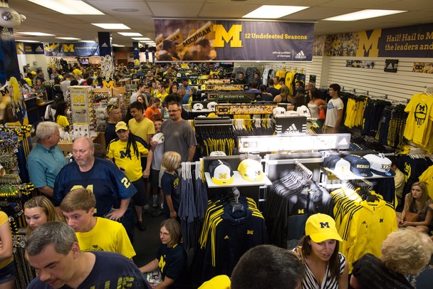 Hundreds waited in line at the M Den in Ann Arbor to have former Michigan Wolverines Denard Robinson, Mike Martin, Jordan Kovacs and Marcus Ray sign autographs on Wednesday, July 10. 
Courtney Sacco I AnnArbor.com    