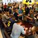 Hundreds wait in line for hours at the M Den in Ann Arbor to have former Michigan football players Denard Robinson, Mike Martin, Jordan Kovacs and Marcus Ray sign autographs on Wednesday, July 10. 
Courtney Sacco I AnnArbor.com    