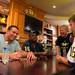 Former Michigan football player Marcus Ray and Mike Martin sign an autograph for 6-year-old Edison Hannahs at the M Den in Ann Arbor on Wednesday, July, 10. 
Courtney Sacco I AnnArbor.com    