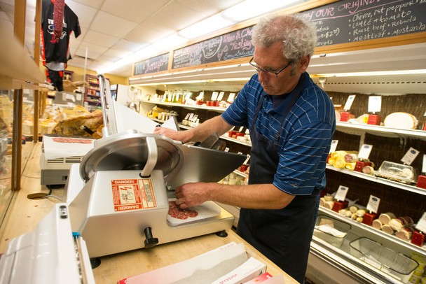 Tommy York uses the deli slicer at Morgan and York in Ann Arbor.
Courtney Sacco I AnnArbor.com
