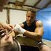 Greg Sizemore of Ypsilanti has his hands taped up before his fight at A2 Fest at the Washtenaw Farm Council Grounds, Friday, July 12.
Courtney Sacco I AnnArbor.com  