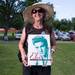 Elvis fan Kathy Torok of Calhoun GA  poses for a photo with the Elvis book she won during trivia at the Michigan Elvisfest in Ypsilanti Saturday, July 13.
Courtney Sacco I AnnArbor.com 