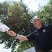Ann Arbor police sergeant Hickey hands out fans on East Liberty Street during the Ann Arbor Art Fair on Wednesday, July 17, 2013. 
Courtney Sacco I AnnArbor.com