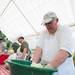 Volunteers mix coleslaw made with a secret local recipe during the 60th Manchester Chicken Broil.  
Courtney Sacco I AnnArbor.com 