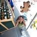 7-year-old Souleyman Ribier plays with a climbing bar toy on South Main Street during the Guild's Ann Arbor Summer Art Fair on Thursday, July 18, 2013.
Courtney Sacco I AnnArbor.com