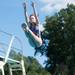 A 15-and-under diver jumps off the board during the third  day of the WISC championships at the Huron Valley Swim Club in Ann Arbor, Wednesday, July 24.
Courtney Sacco I AnnArbor.com     