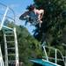 Jake K. jumps off the board during the 15 and over diving portion of the WISC championships, at the Huron Valley Swim Club in Ann Arbor, Wednesday, July 24.
Courtney Sacco I AnnArbor.com     