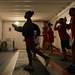 In a room light with by floodlights Couch Derek Hunt trains with the teams younger members.
Courtney Sacco I AnnArbor.com  