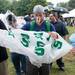 Brent Jalito, of Canton, puts on a poncho during the Michigan Summer Beer Festival at Riverside Park in Ypsilanti, Saturday, July 27.
Courtney Sacco I AnnArbor.com