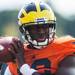 Michigan quarterback Devin Gardner throws a ball on the practice field outside of the Al Glick Field House on Thursday, August 8, 2013. 
Courtney Sacco I AnnArbor.com